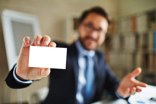 Businessman showing blank card to partners