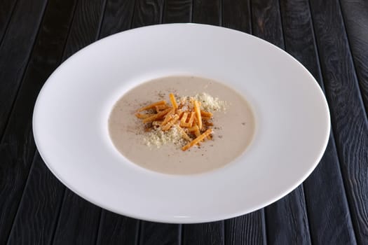 Mushroom soup puree with bacon flakes