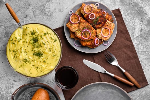 Top view of roasted pork fillet mignon , served with mashed potato and red onion and dill