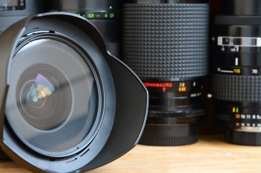 Professional photo art equipment. Assortment of modern lenses. Thematically for the sale or rental of photographic equipment and the presentation of photo lessons