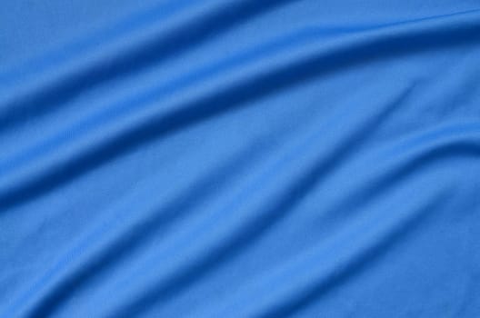Detailed polyester blue fabric texture with many long folds