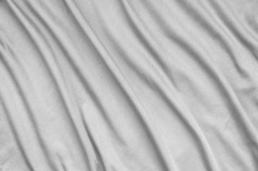 Detailed polyester white fabric texture with many long folds