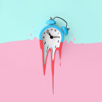 Time is running out concept shows alarm clock that is dissolving down by melting in pastel pink liquid substance . Surreal style image
