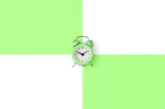A small green alarm clock is located between areas of green and white colors. Time management concept. Flat lay minimal template with copy space. Top view