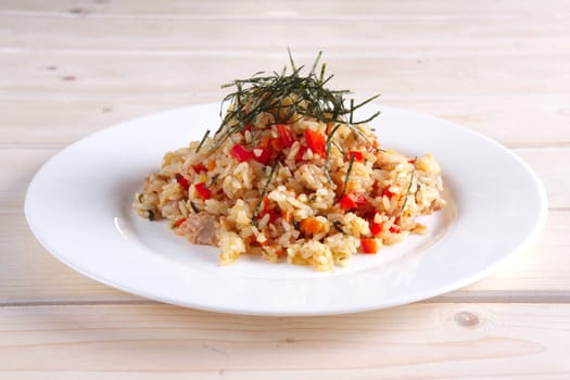 Pilaf with fish, pepper and seaweed