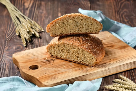 Homemade wheat bread on wooden cutting board