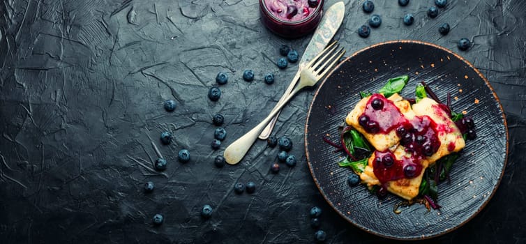 Delicious baked fish with berry sauce. Stewed pangasius with blueberries