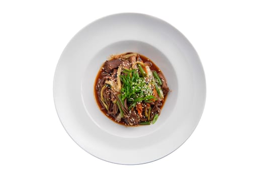 Top view of wok with beef and green beans isolated on white background