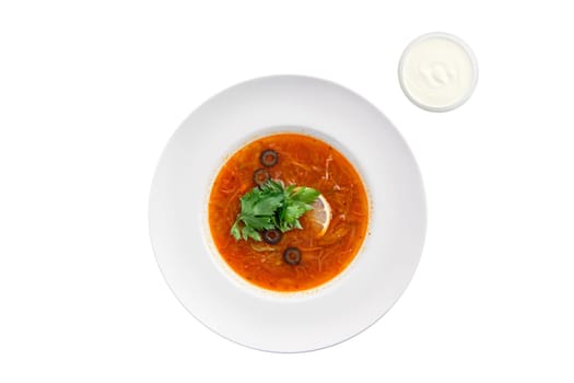 Traditional solyanka sour soup isolated on white background, top view