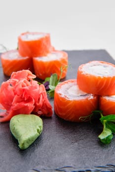 Close up view of rolls with salmon isolated on white