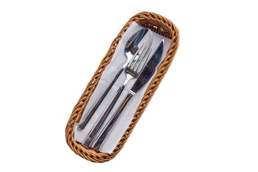 Set of cutlery in basket isolated on white background