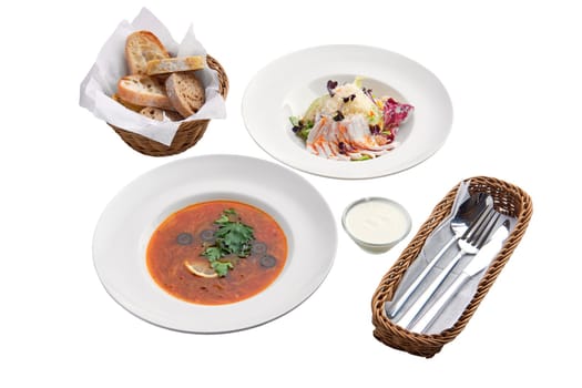 Solyanka soup and salad with cabbage and ham  isolated on white background