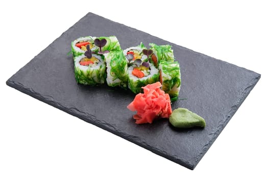 Set of rolls with seaweed chuka salad isolated on white background