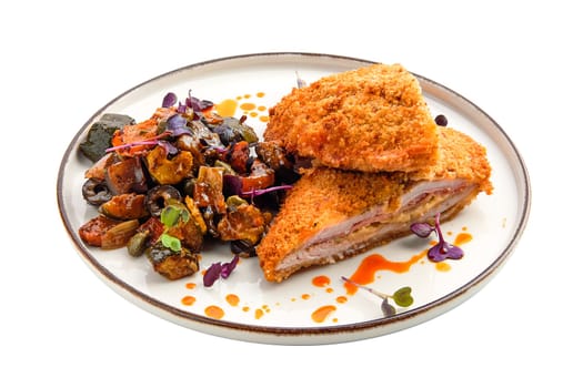 Cutlet with stuffing in breading with fried eggplant, olives and onion isolated on white background