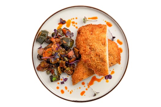 Cutlet with stuffing in breading with fried eggplant, olives and onion isolated on white background