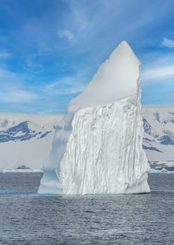 Antarctic iceberg landscape in Cierva Cove - a deep inlet on the west side of the Antarctic Peninsula, surrounded by rugged mountains and dramatic glacier fronts.