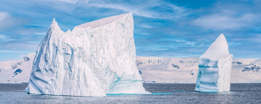 Antarctic iceberg landscape in Cierva Cove - a deep inlet on the west side of the Antarctic Peninsula, surrounded by rugged mountains and dramatic glacier fronts.