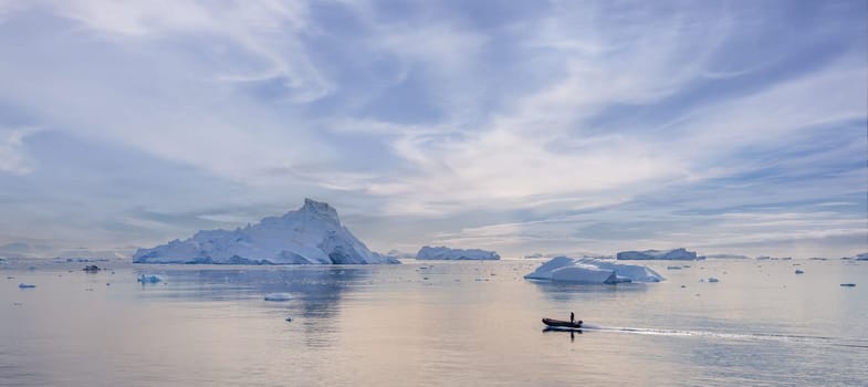 Antarctic iceberg landscape in Cierva Cove - a deep inlet on the west side of the Antarctic Peninsula, surrounded by rugged mountains and dramatic glacier fronts.