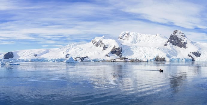 Antarctic iceberg landscape in Cierva Cove - a deep inlet on the west side of the Antarctic Peninsula, surrounded by rugged mountains and dramatic glacier fronts.