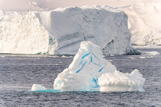 Antarctic iceberg landscape in Cierva Cove - a deep inlet on the west side of the Antarctic Peninsula, surrounded by rugged mountains and dramatic glacier fronts.