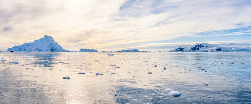 Antarctic iceberg landscape in Cierva Cove - a deep inlet on the west side of the Antarctic Peninsula, surrounded by rugged mountains and dramatic glacier fronts.
