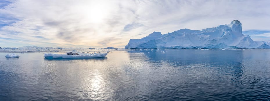 Antarctic iceberg landscape in Cierva Cove - a deep inlet on the west side of the Antarctic Peninsula, surrounded by rugged mountains and dramatic glacier fronts.