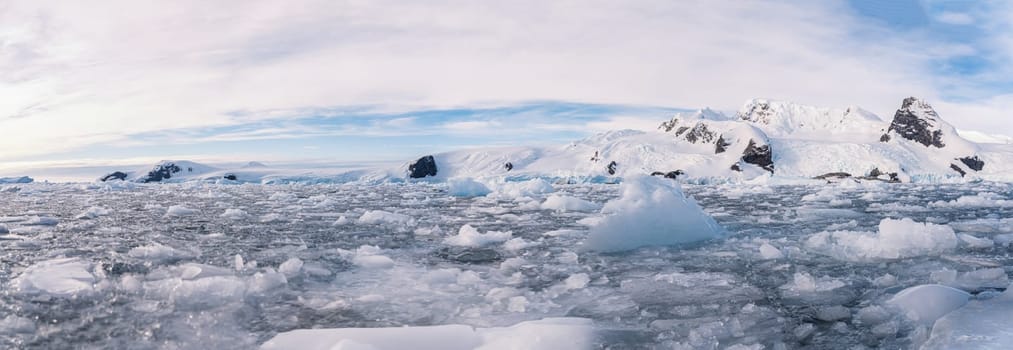 Antarctic iceberg landscape in Cierva Cove - a deep inlet on the west side of the Antarctic Peninsula, surrounded by rugged mountains and dramatic glacier fronts.
