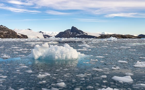Antarctic iceberg landscape in Cierva Cove - a deep inlet on the west side of the Antarctic Peninsula, surrounded by rugged mountains and dramatic glacier fronts.