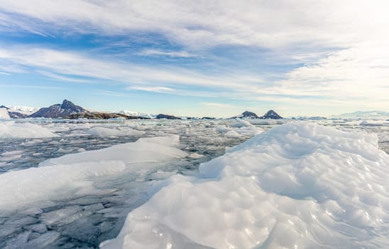 Antarctic iceberg landscape in Cierva Cove - a deep inlet on the west side of the Antarctic Peninsula, surrounded by rugged mountains and dramatic glacier fronts.