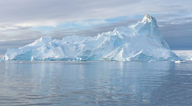 Antarctic iceberg landscape in Cierva Cove - a deep inlet on the west side of the Antarctic Peninsula, surrounded by rugged mountains and dramatic glacier fronts.