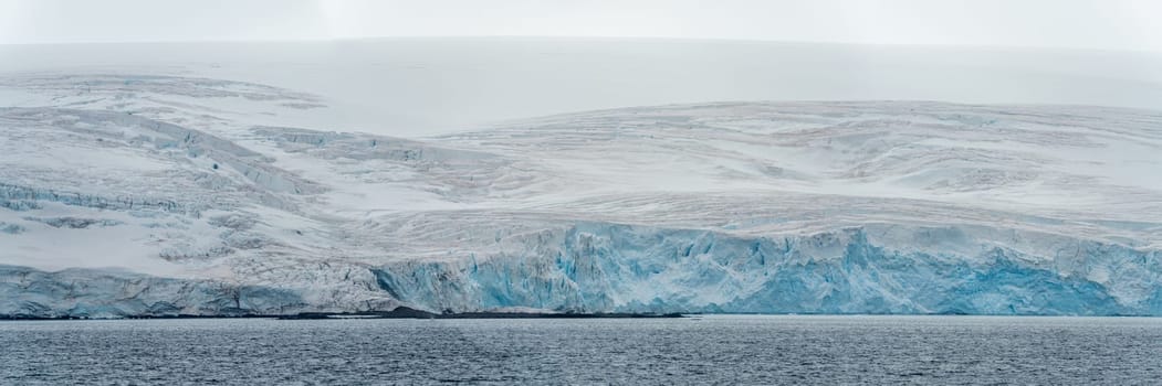 Antarctic iceberg landscape in Cierva Cove - a deep inlet on the west side of the Antarctic Peninsula, surrounded by rugged mountains and dramatic glacier fronts.