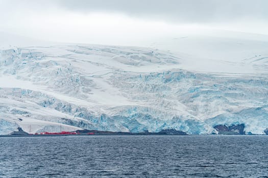 Antarctic iceberg landscape in Cierva Cove - a deep inlet on the west side of the Antarctic Peninsula, surrounded by rugged mountains and dramatic glacier fronts.