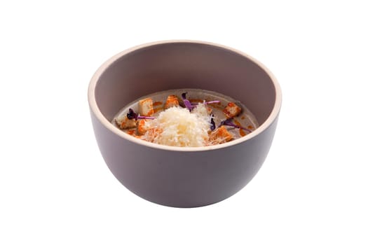 Mushroom soup puree with sheese and croutons isolated on white background