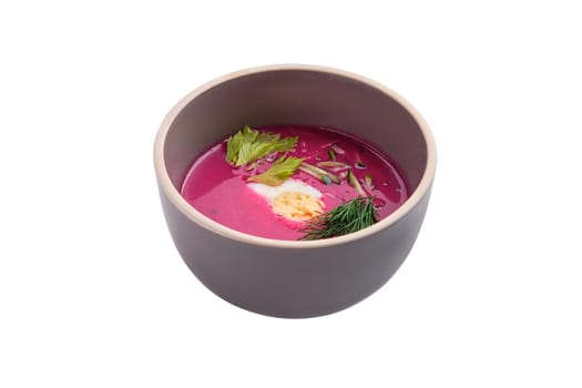 Cold summer soup with beet, cucumber and egg isolated on white background