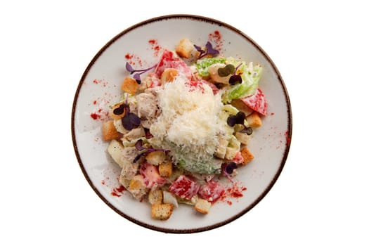 Salad with chicken, cheese, tomato, cabbage and crouton isolated on white background