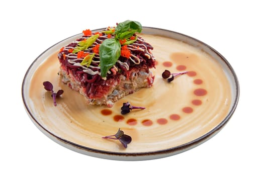 Salad with herring, beet, potato, carrot and caviar isolated on white background