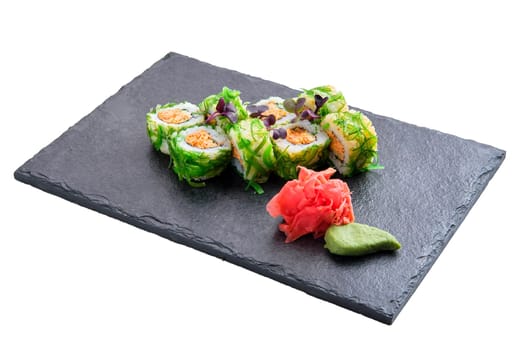 Set of rolls with crab paste, seaweed chuka salad isolated on white background