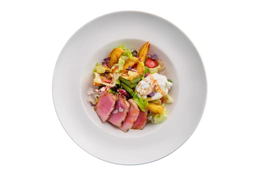 Grilled tuna with potato, cabbage, green beans and poached egg isolated on white background