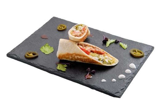 Rolled pita bread with minced meat, pickled cucumber, cabbage and tomato isolated on white background