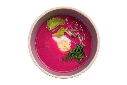 Cold summer soup with beet, cucumber and egg isolated on white background