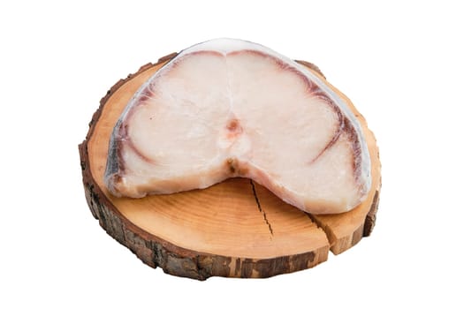 Frozen blue shark steak isolated on white background