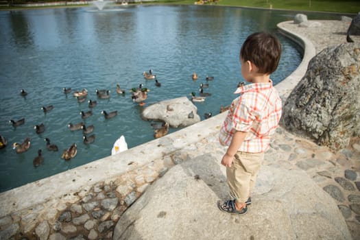 Young Chinese and Caucasian Boy Having Fun at the Park.
