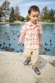 Young Chinese and Caucasian Boy Having Fun at the Park.