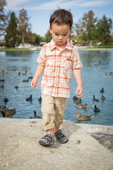 Young Chinese and Caucasian Boy Having Fun at the Park.