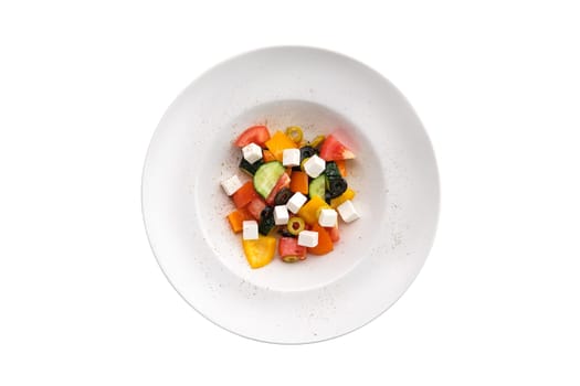 Salad with pepper, tomato, cucumber, olives and feta isoalted on white background