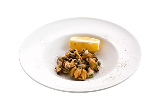 Marinated mussels and slice of lemon isoalted on white background