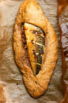 Seafood, mackerel roasted in spicy dough. Fish baked in dough