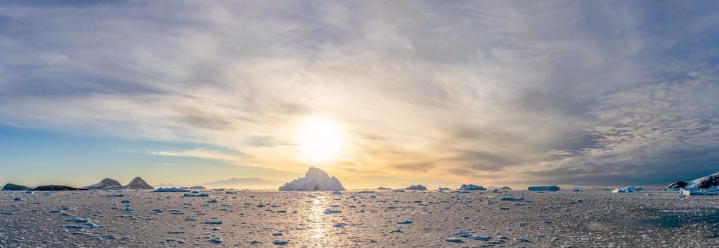 dramatic, colourful sunset / evening atmosphere in Cierva Cove - a deep inlet on the west side of the Antarctic Peninsula, surrounded by Cierva Bay in San Martín Land - Antarctica photographed from an expedition ship