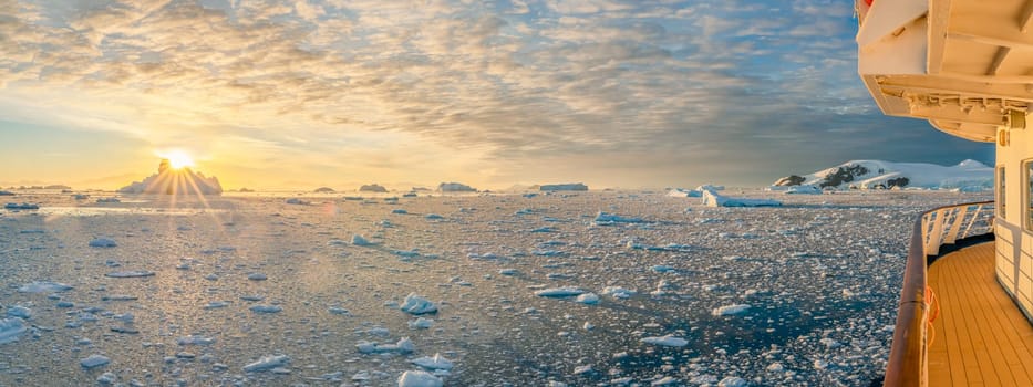 dramatic, colourful sunset / evening atmosphere in Cierva Cove - a deep inlet on the west side of the Antarctic Peninsula, surrounded by Cierva Bay in San Martín Land - Antarctica photographed from an expedition ship