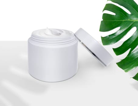 Luxury skin care product ad, of Cosmetic cream with monstera leaf
